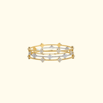 Gold and diamond bracelet on a white background